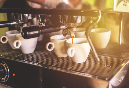 Make cup of the coffee in white cup capucino espresso in a coffee shopの写真素材