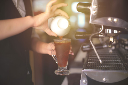 Make cup of the coffee in white cup capucino espresso in a coffee shopの写真素材