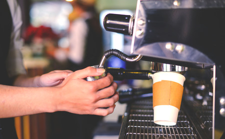 Make cup of the coffee in white cup capucino espresso in a coffee shopの写真素材