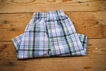 Men's boxer shorts on wood background