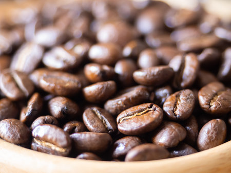 brown arabica coffee bean roast level medium to dark taste seed single origin caffeine espresso drink food cafe beverage Chiang Rai, Thailand coffee on wooden table background top view selected focusの写真素材