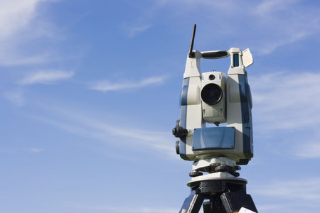 Theodolite against blue sky.