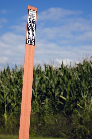 Survey marker in the field, next to the section corner or benchmark.の写真素材