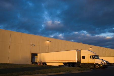 Semi Truck in the loading zone of the warehouseの写真素材