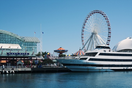Navy Pier architecture - the greenhouse on the left and the Ferris Wheel on the right. Seen during the summer morning from the boat on Lake Michigan. Navy Pier is a 3300 feet pier located in downtown Chicago.のeditorial素材