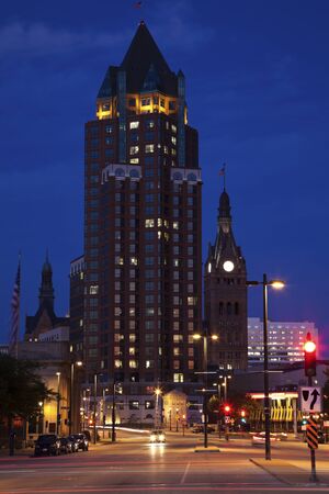 Milwaukee, Wisconsin, USA August 15, 2011 Milwaukee Center building seen during the summer evening. This 426 feet building was built in 1988 and is located at 101-111 East Kilbourn Avenue. Towers of Milwaukee City Hall on the left and right.のeditorial素材