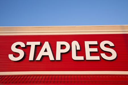 Staples sign seen on the wall of the building in Chicago. Staples is the retailer of office accessories and supplies. The company was founded in 1991. Chicago, Illinois, USA September 21, 2011のeditorial素材