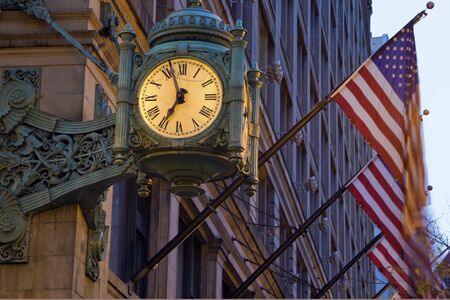 Old Clock and Flags - State Street. Seen early morning before sunrise.の写真素材