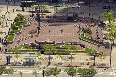 Cleveland, Ohio, USA - May 20, 2010 Pedestrians and cars moving around Public Square in the center...
