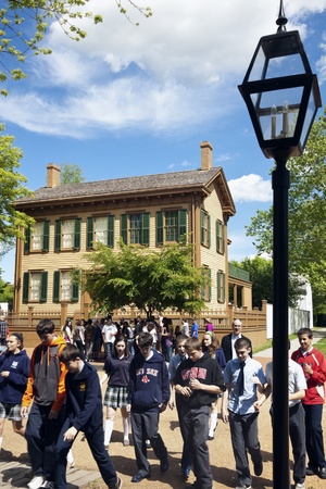 Springfield, Illinois, USA - April 17, 2012 Young visitors walking in front of Lincoln Home National Historic Site in Springfield, Illinois, USA. The building was bought by Lincoln in 1844 - the only home that Lincoln owned. The house has twelve rooms on のeditorial素材