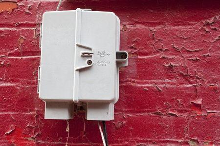 Telephone box on the red brick wall.の写真素材