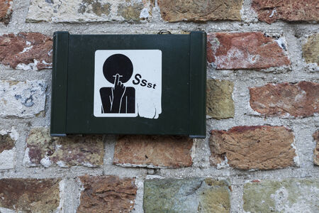 Keep quiet sign seen in Bruges, Belgium.の写真素材