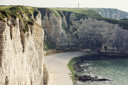 Natural Cliffs in Etretat. D'Antifer Lighthouse in the background. Etretat, Normandy, Franceの写真素材
