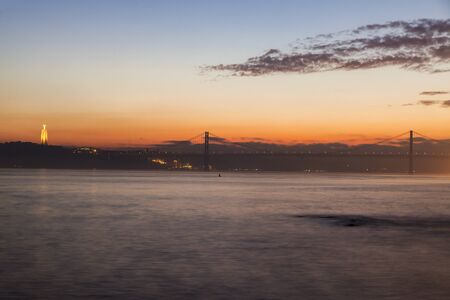 25th of April Bridge and Cristo Rei Statue in Lisbon. Lisbon, Portugal.の写真素材