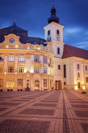 Holy Trinity Church and Sibiu City Hall on the Great Square in Sibiu. Sibiu, Sibiu County, Romania.の写真素材