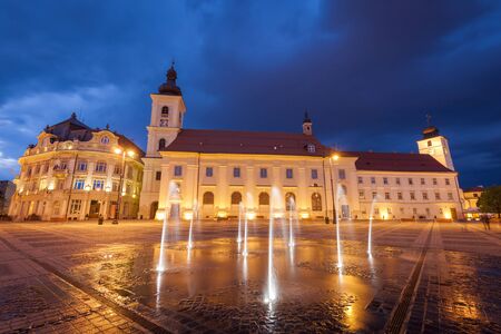 Holy Trinity Church and Sibiu City Hall on the Great Square in Sibiu. Sibiu, Sibiu County, Romania.の写真素材