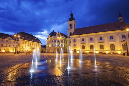 Holy Trinity Church and Sibiu City Hall on the Great Square in Sibiu. Sibiu, Sibiu County, Romania.の写真素材