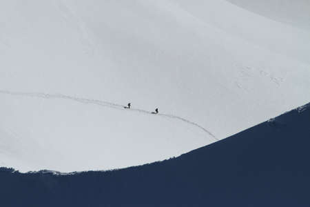 Landscape photography in the Alps including two climbersの写真素材