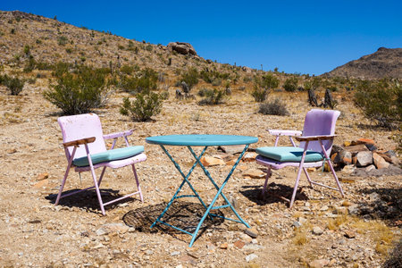 Table and chairs in the desertの写真素材