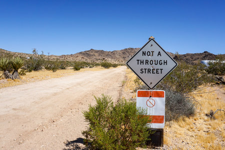 Dirt road with signの写真素材