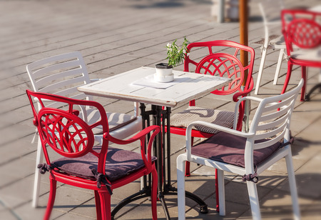 Wooden table and chair in the cafe gardenの写真素材
