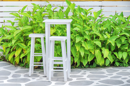 Wooden table in beach club openの写真素材