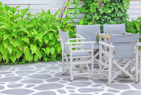 Wooden table in beach club openの写真素材