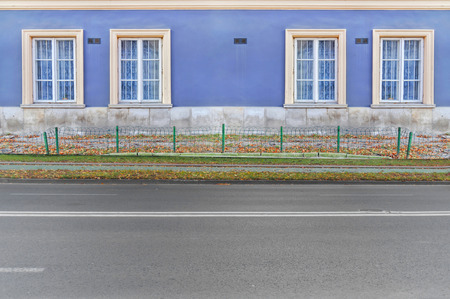 Road in the city with blue buildingの写真素材