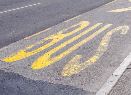 City bus transport lane sign on the asphaltの写真素材