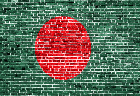 Flag of Bangladesh painted on brick wall, background textureの写真素材