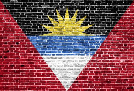 Flag of Antigua Barbuda painted on brick wall, background textureの写真素材