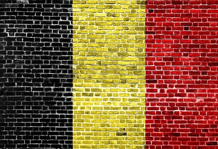 Flag of Belgium painted on brick wall, background textureの写真素材