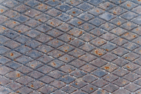 Rusty metal grid plate textureの写真素材