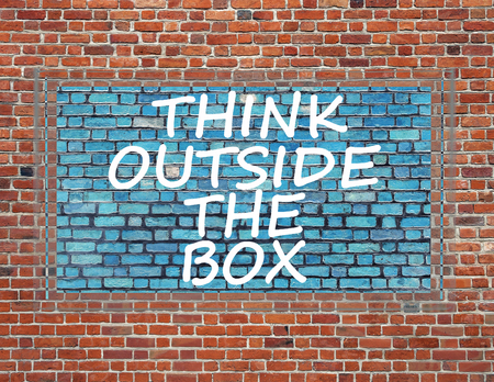 Sign on brick wall to thinking outside the box great brilliant idea new innovationの写真素材