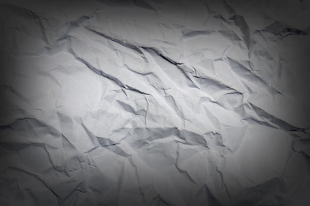 Wrinkled paper great as a background with vignetteの写真素材