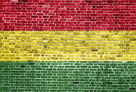 Flag of Bolivia painted on brick wall, background textureの写真素材