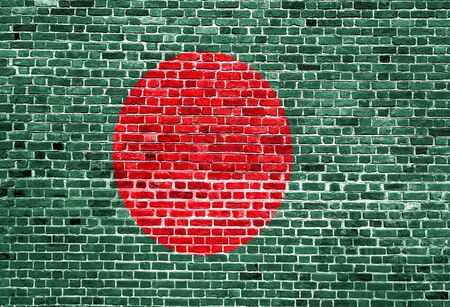 Flag of Bangladesh painted on brick wall, background textureの写真素材