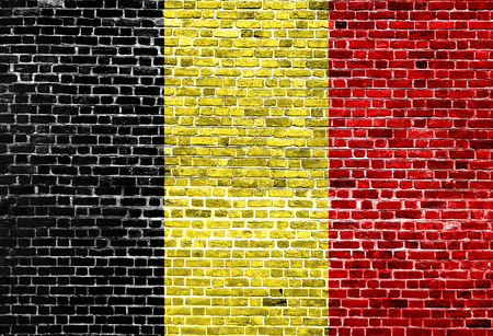 Flag of Belgium painted on brick wall, background textureの写真素材