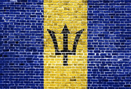 Flag of Barbados painted on brick wall, background textureの写真素材