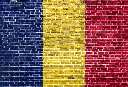 Flag of Chad painted on brick wall, background textureの写真素材