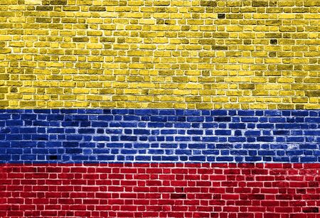 Flag of Columbia painted on brick wall, background textureの写真素材
