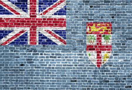 Flag of Fiji painted on brick wall, background textureの写真素材