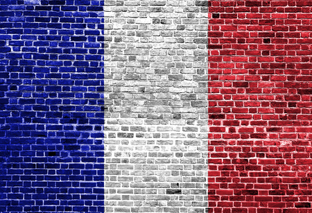 Flag of France painted on brick wall, background textureの写真素材
