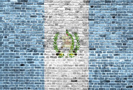 Flag of Guatemala painted on brick wall, background textureの写真素材