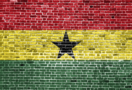Flag of Ghana painted on brick wall, background textureの写真素材