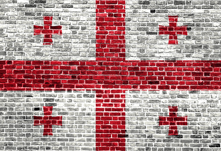 Flag of Georgia painted on brick wall, background textureの写真素材