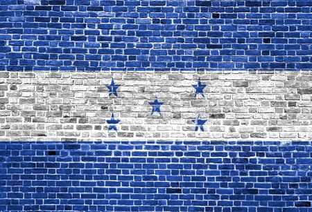 Flag of Honduras painted on brick wall, background textureの写真素材