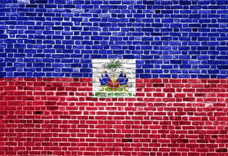 Flag of Haiti painted on brick wall, background textureの写真素材