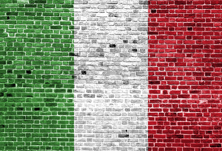 Flag of Italy painted on brick wall, background textureの写真素材