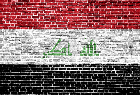 Flag of Iraq painted on brick wall, background textureの写真素材